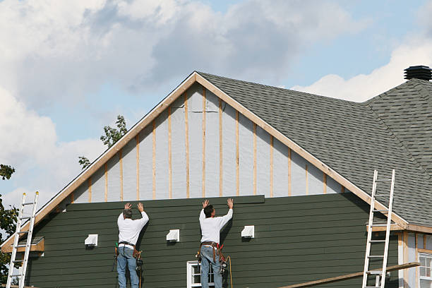 Professional Storm Damage Siding Repair technician working in Seville, OH